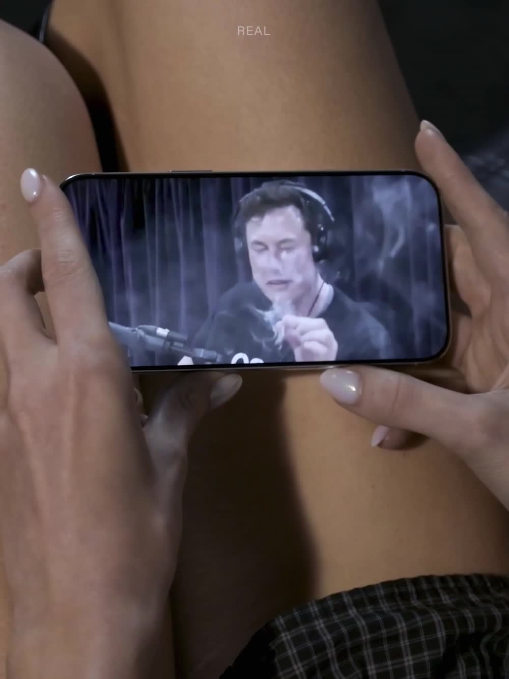A phone held in two hands playing the demo